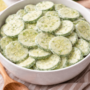 Mom's Fresh Cucumber Salad Sitting in a white serving bowl
