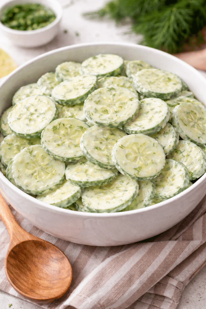 Mom's Fresh Cucumber Salad Sitting in a white serving bowl