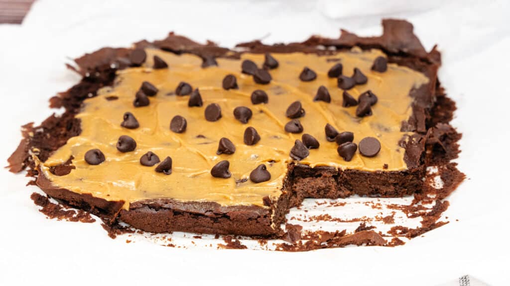 Pumpkin Protein Brownies with melted peanut butter and chocolate chips