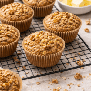 Banana Peanut Butter Greek Yogurt Oatmeal Muffins sitting on a cooling rack
