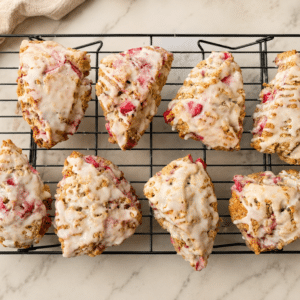 strawberry lemon sourdough scones sitting on a cooling rack